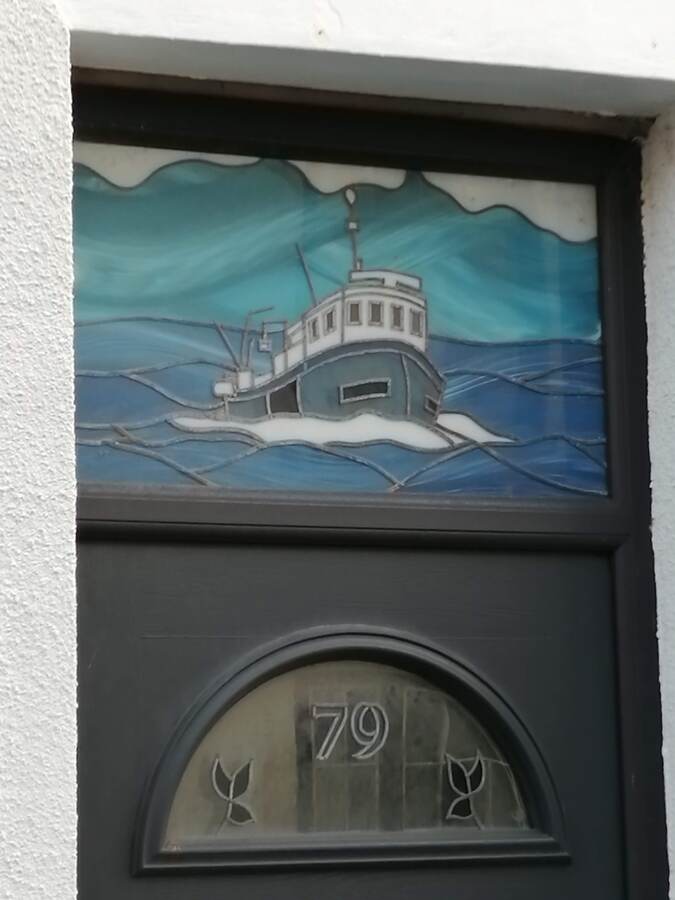 Queen Street showing one of many Staine Glass front doors